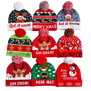 Weihnachts-Strickm&uuml;tze mit Bommel, bedruckte Winterm&uuml;tze mit Weihnachts-Rentier und Schneemann